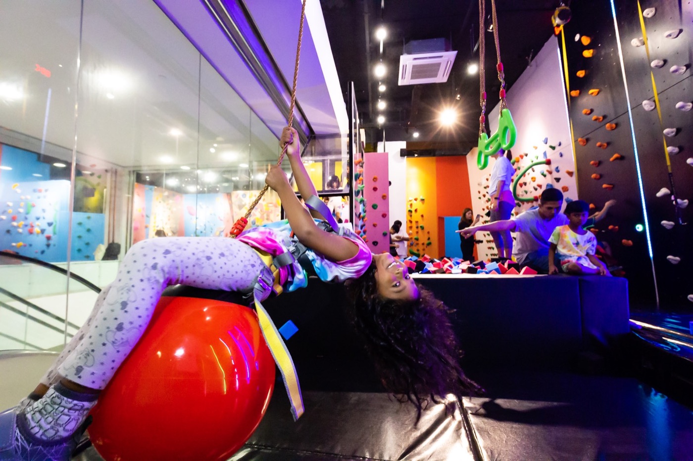 A child enjoying a guided climbing activity at BFF Climb